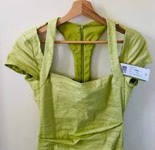 Load image into Gallery viewer, Nicole Miller Artelier pastel green figure flattering designer spring/summer dress.