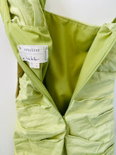 Load image into Gallery viewer, Nicole Miller Artelier pastel green figure flattering designer spring/summer dress.
